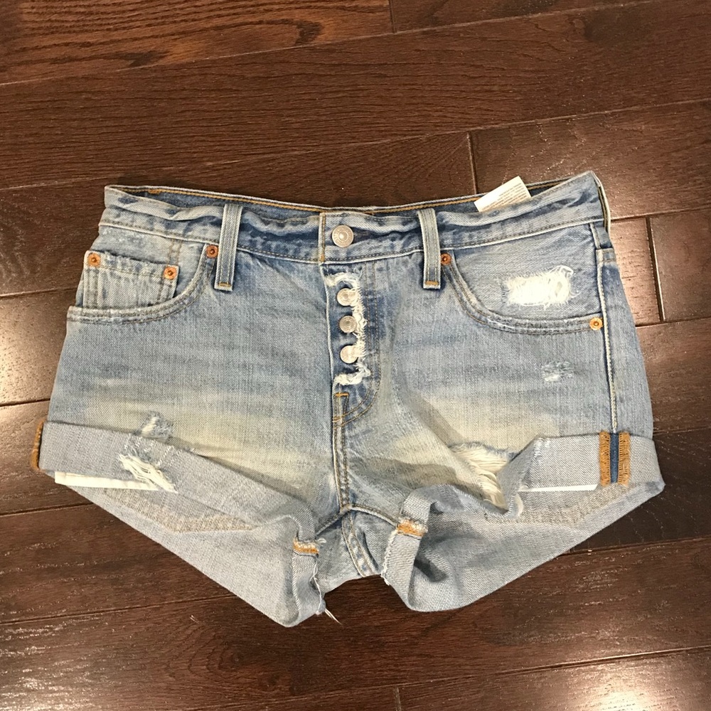 Levi’s light wash denim destroyed shorts, size 24